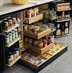 kitchen cabinet drawers opened with spices and condiments displayed inside